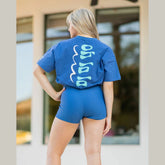 young woman wearing navy oh la la tshirt